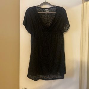 Great condition black cover up. Semi-sheer, short length.
